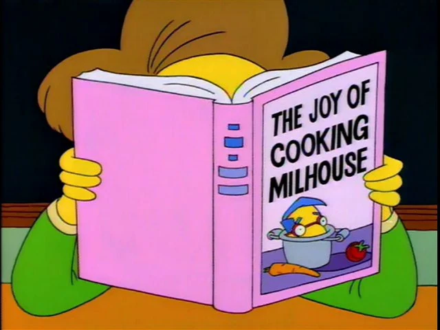 The Simpsons still with the book 'The Joy of Cooking Milhouse'